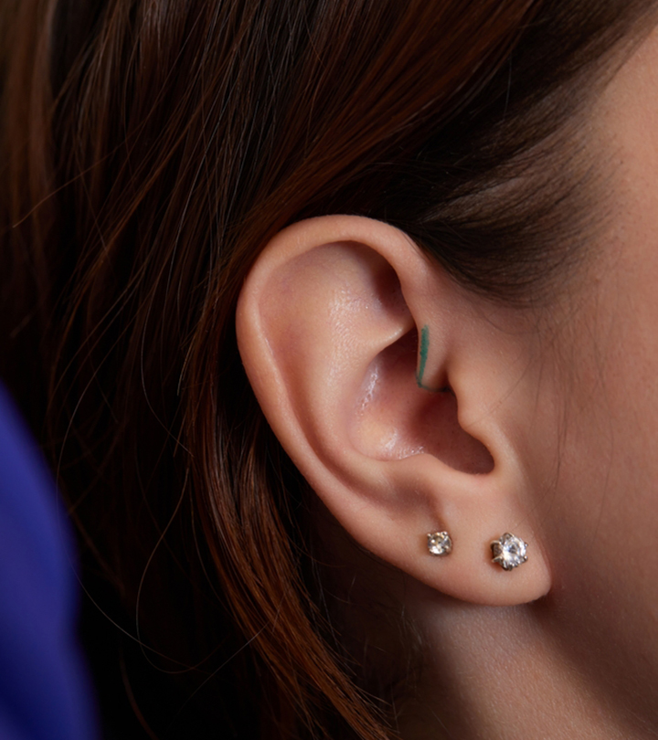 A woman with double ear piercing