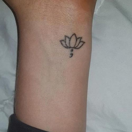 Lotus outline semicolon tattoo design