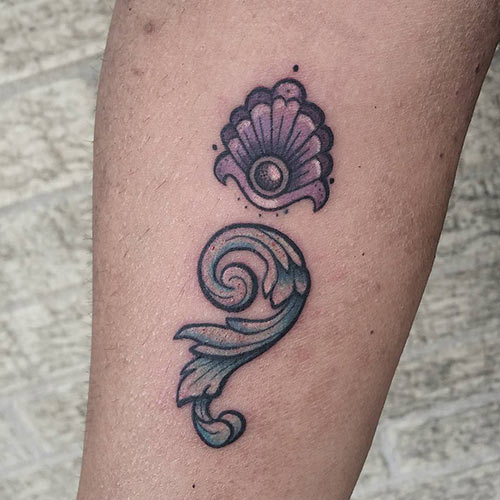 Ornate semicolon tattoo design